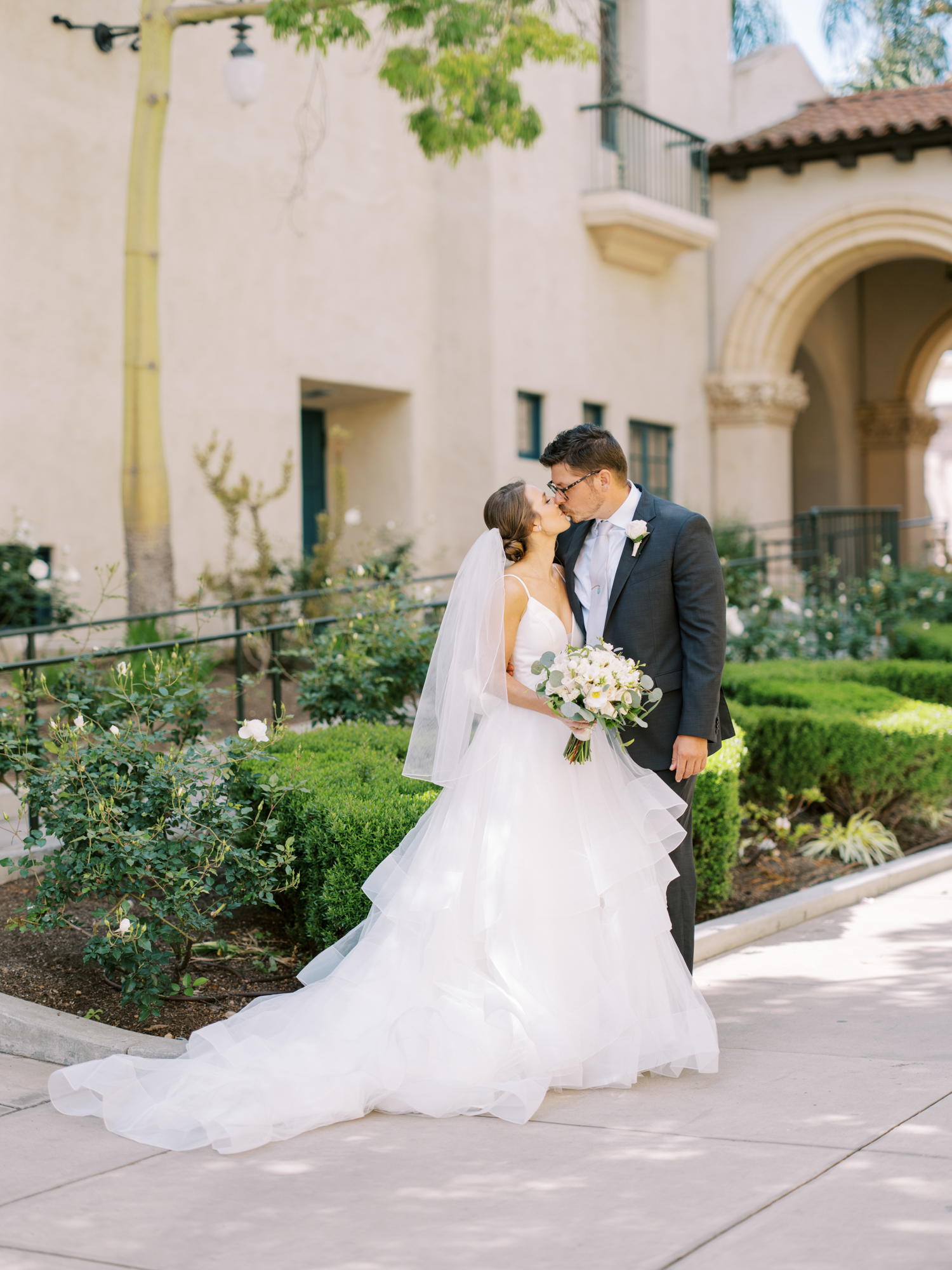 San Diego Wedding 2021 at Prado in Balboa Park Bride and Groom on walkway 