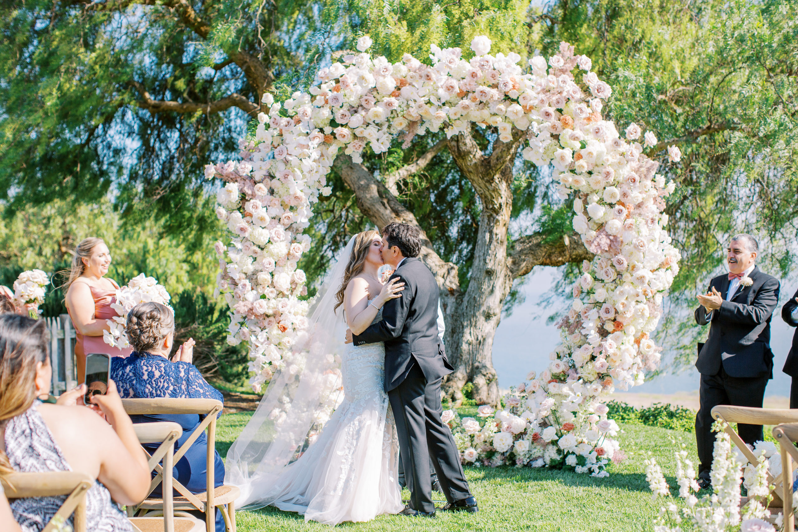 Catalina View Gardens Wedding by mirelle carmichael - the bride and groom share their first kiss as husband and wife