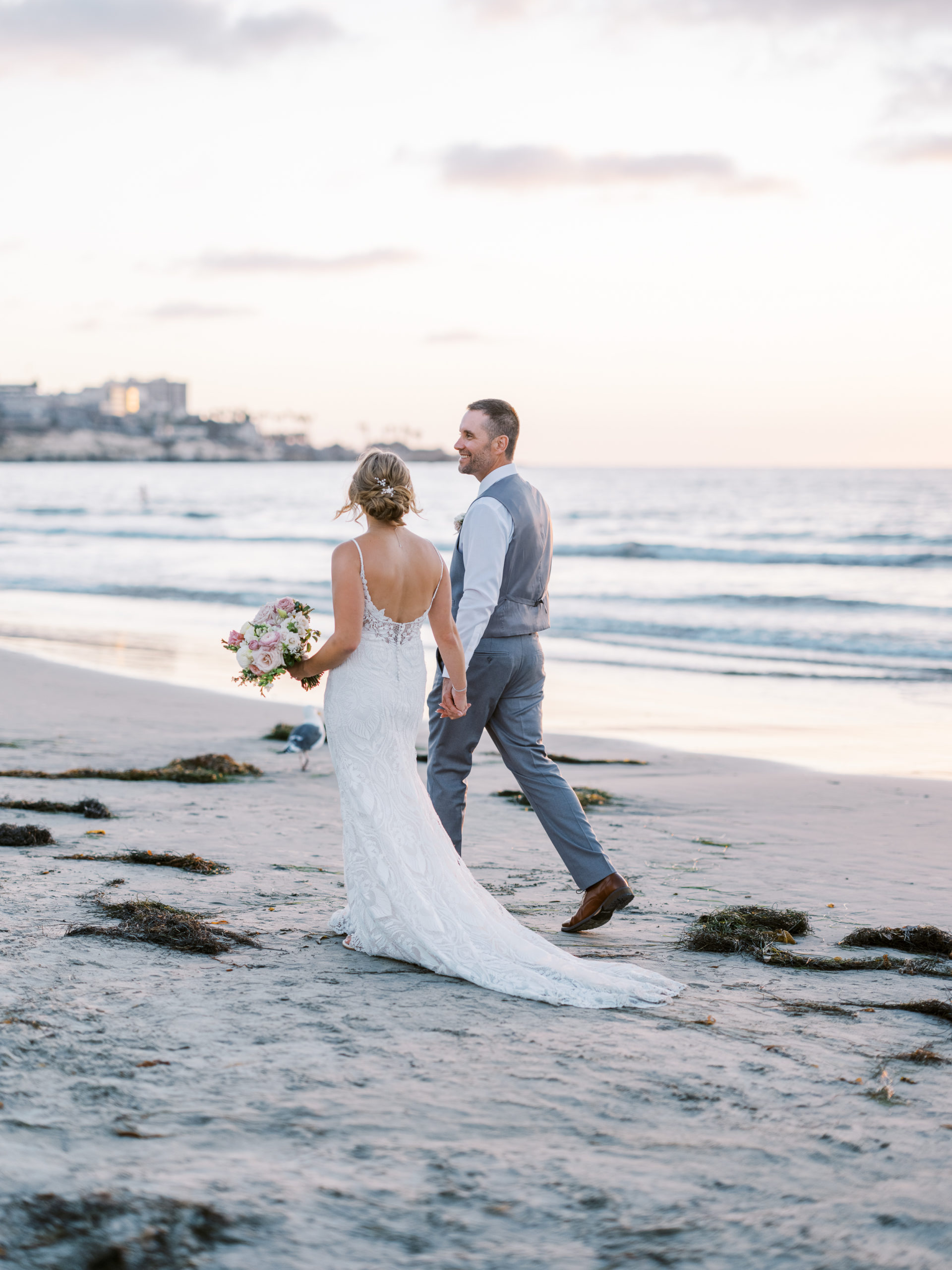 la jolla shores hotel wedding bride and groom on beach