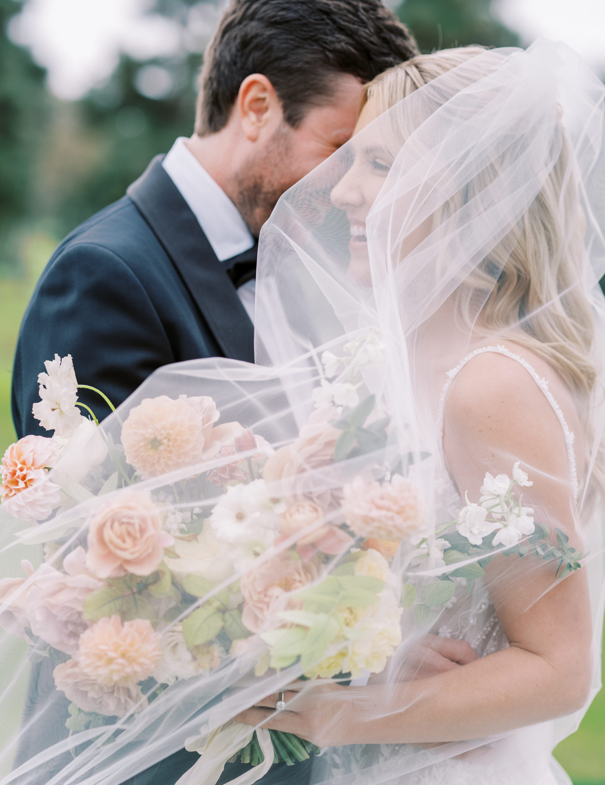 La Jolla Country Club Wedding bride and groom under veil
