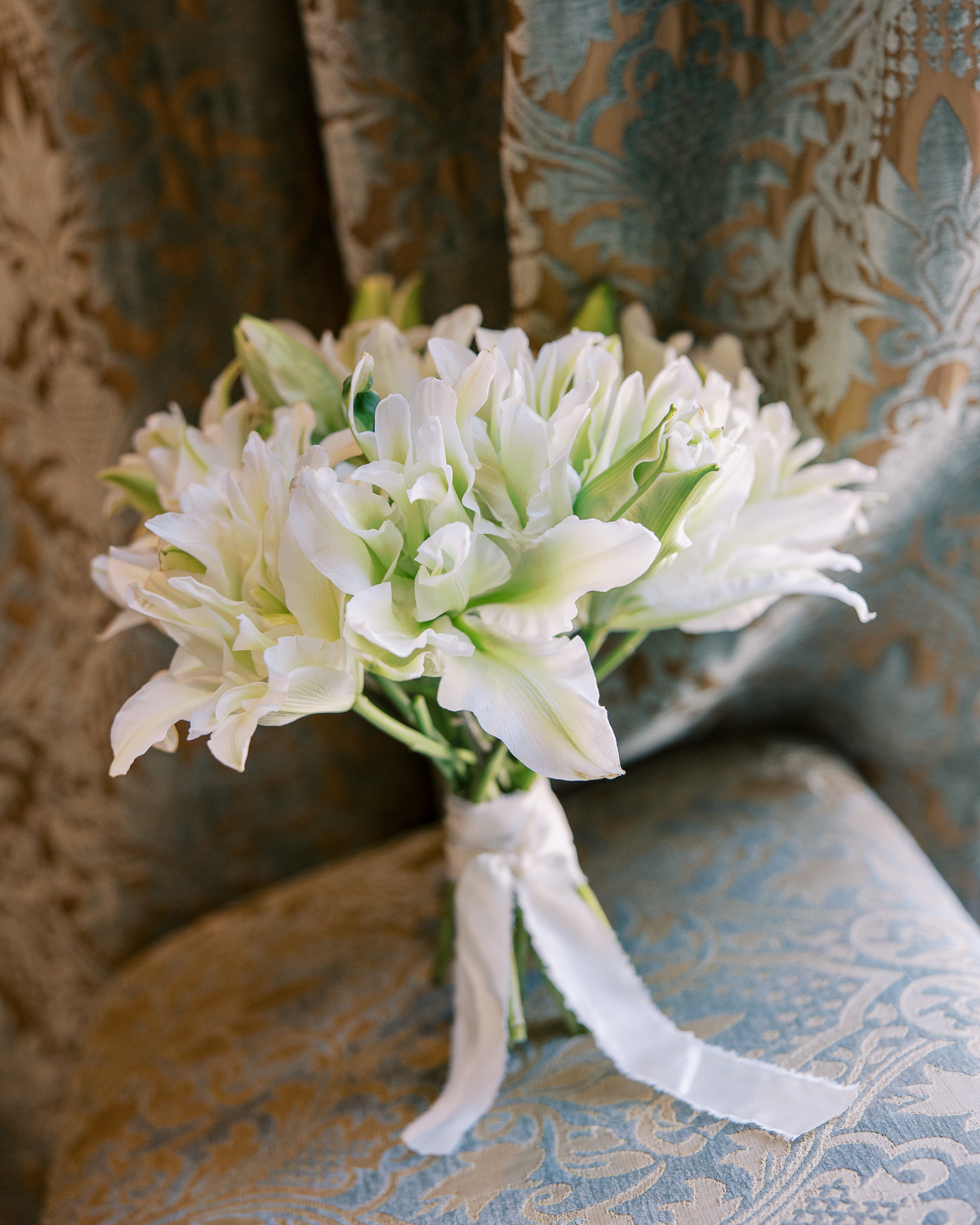 Floral spring bridal bouquet of white lilies

