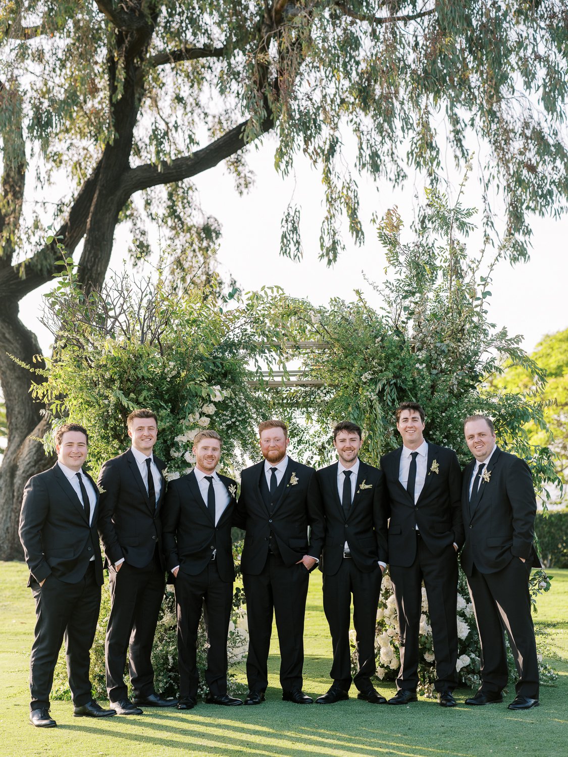 Groomsmen in classic black suits at La Jolla Country Club