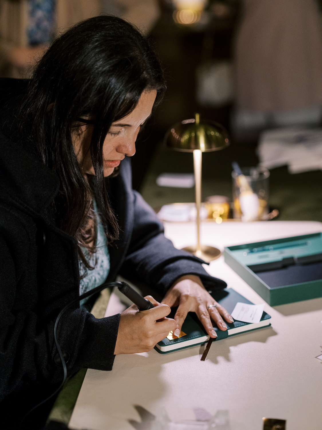Claudia Strenger does calligraphy for guests at Lakehouse Resort San Marcos 