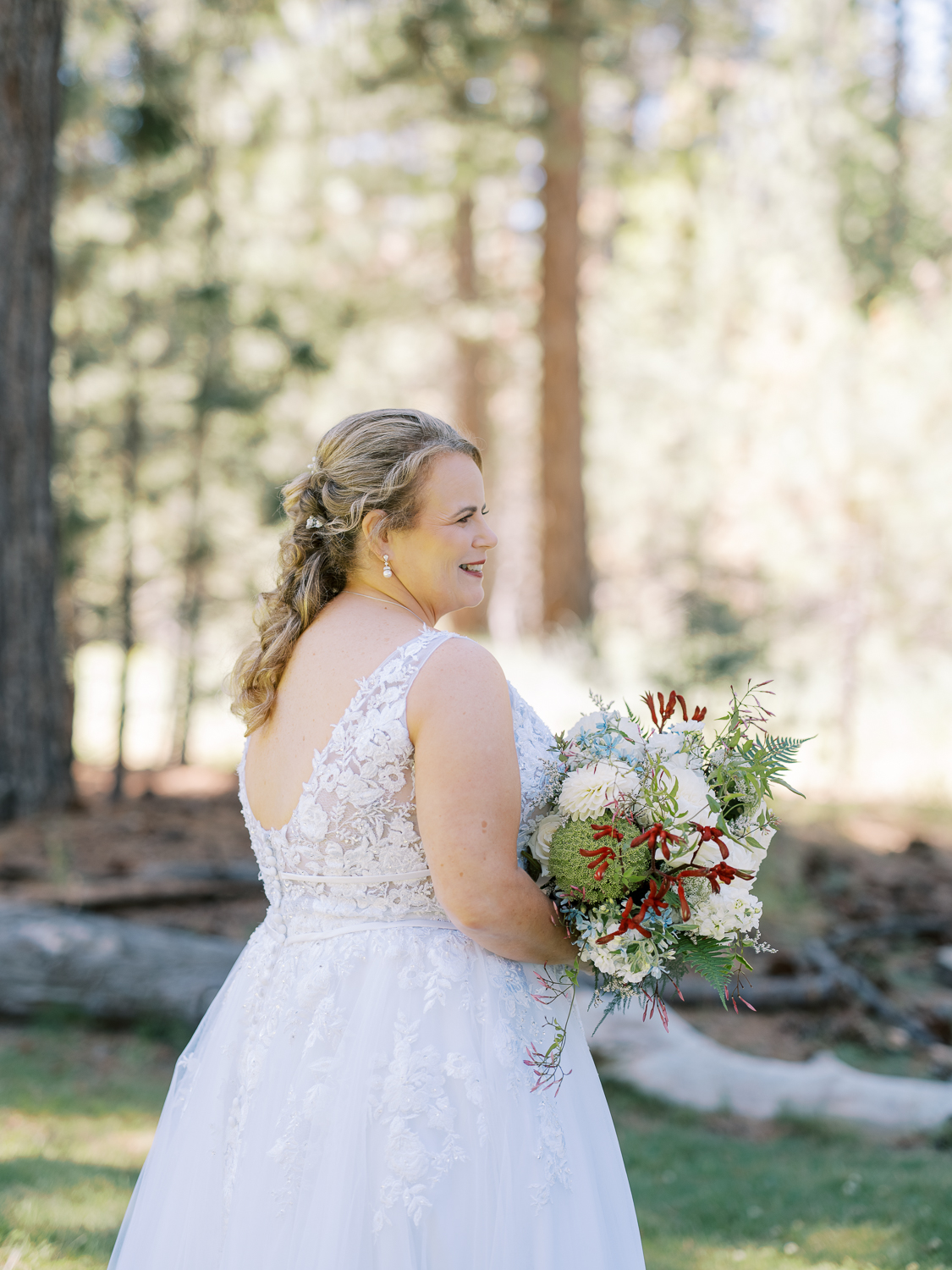 Soft curls and a gorgeous lace wedding dress