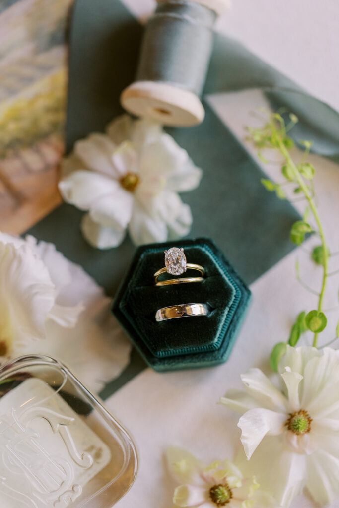 Oval engagement ring and gold wedding bands