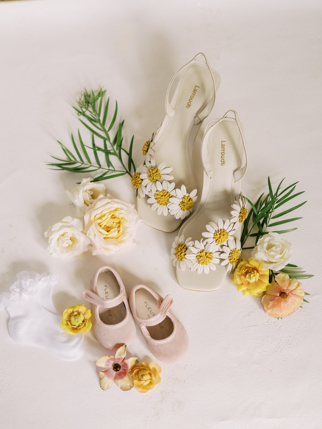 mom and baby shoes on flat lay at del mar wedding