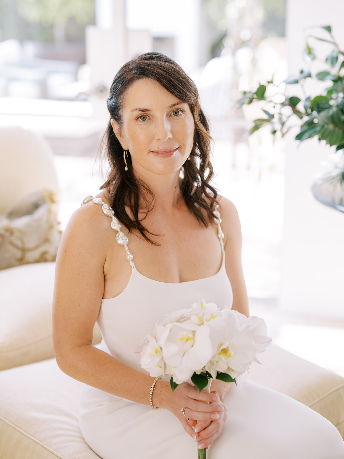 bride sitting in living room at del mar wedding in private home