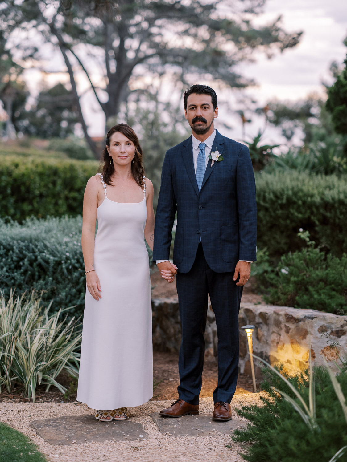 bride and groom portrait as the sun sets in del mar
